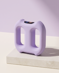 Unwind vibration ring in lavender on a stone plinth