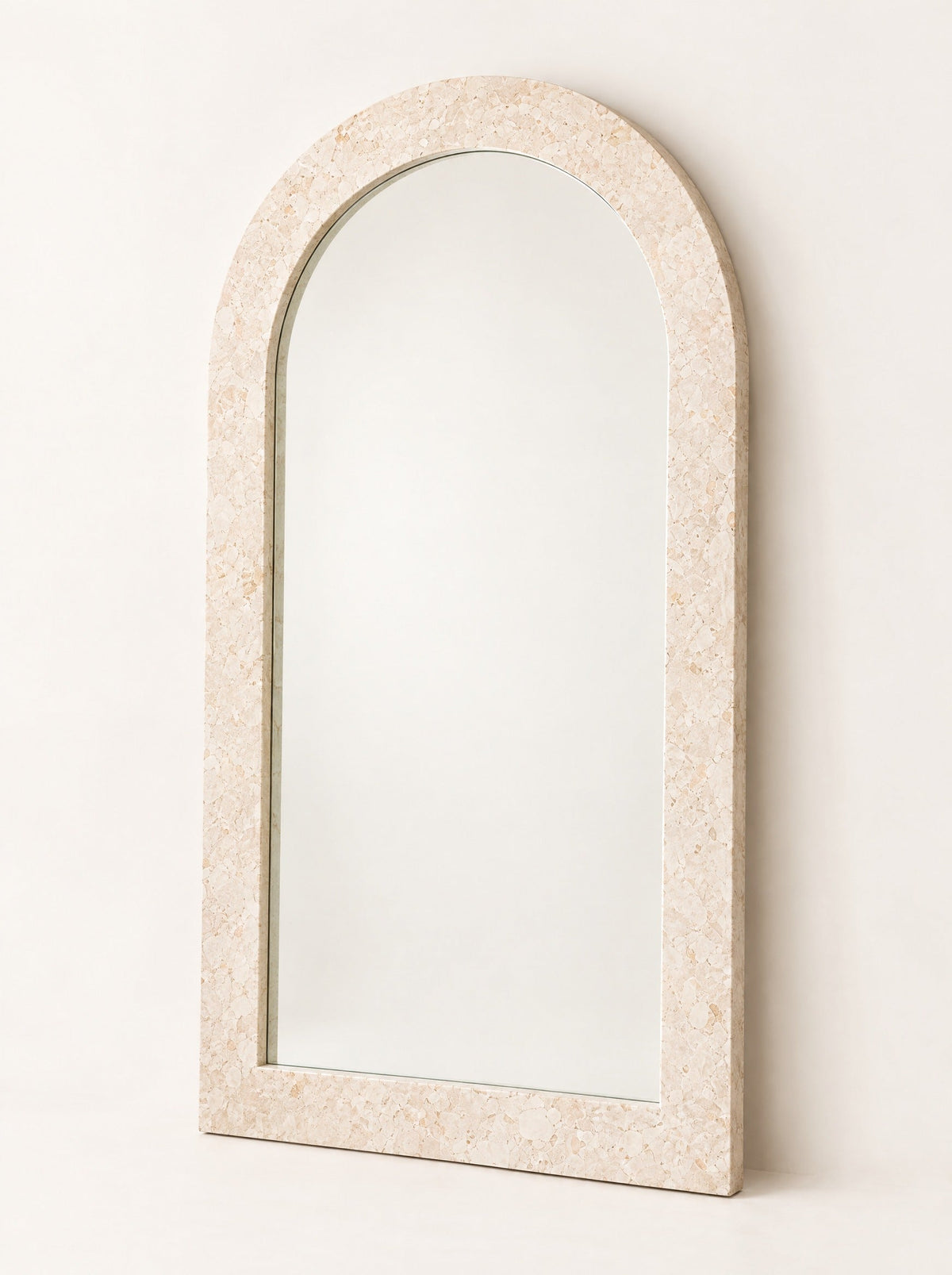 Arch Stone-Effect Floor Mirror, close-up studio photo on a warm white background