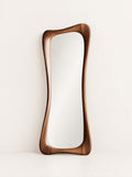 Atelier Sculpted Walnut Mirror, studio photo on a warm white background
