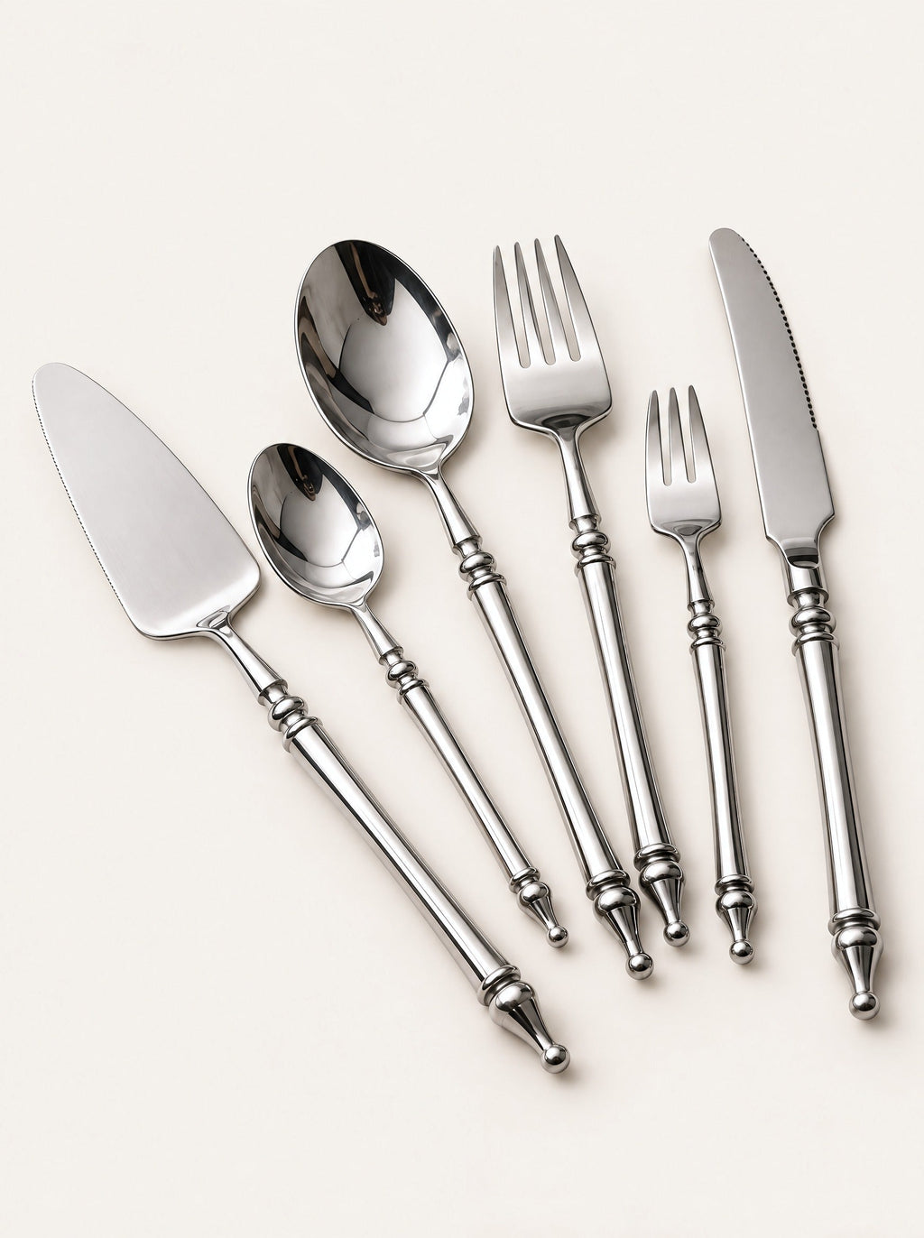 Baluster Steel Cutlery Set, close-up studio photo on a warm white background