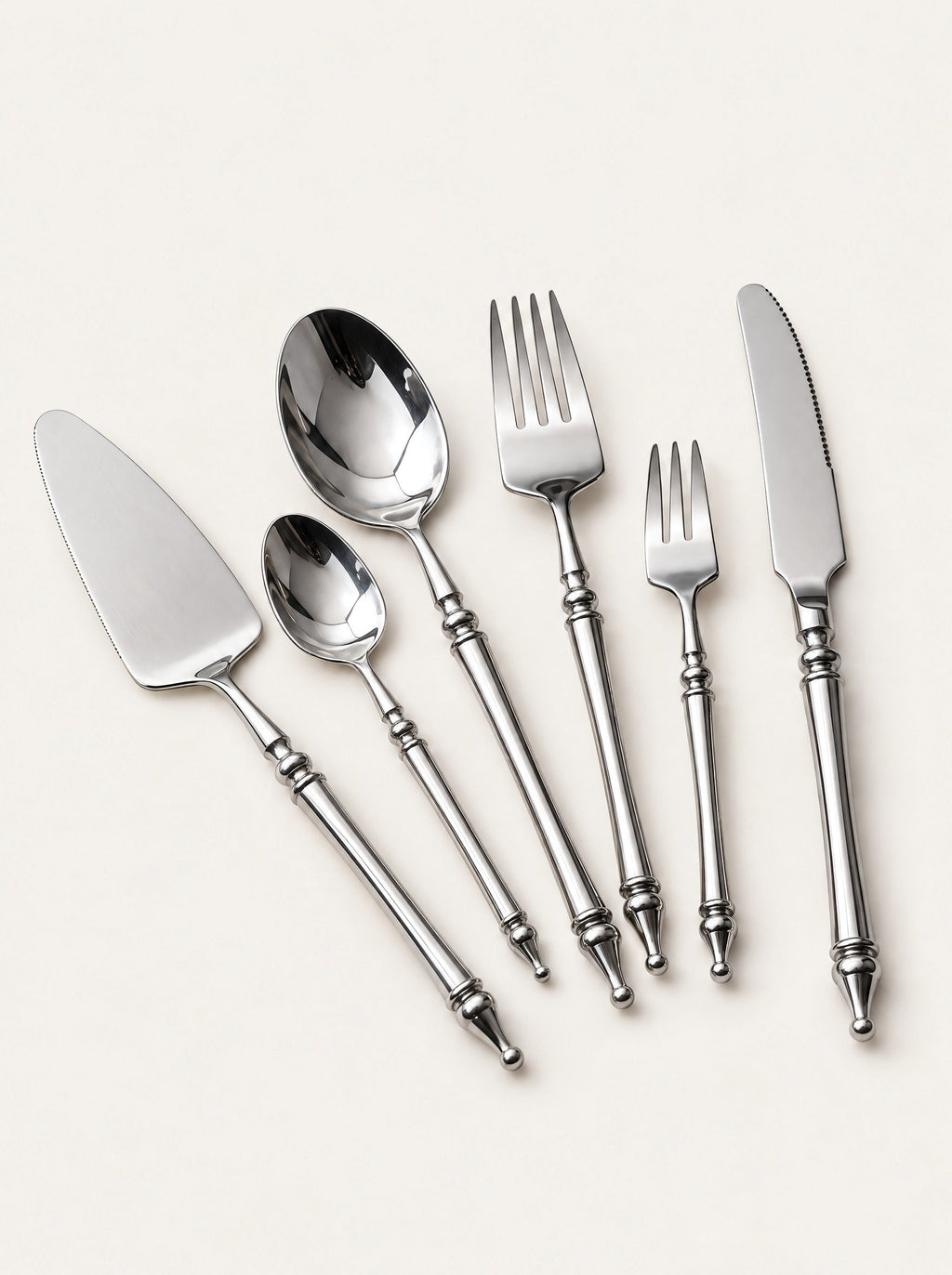 Baluster Steel Cutlery Set, studio photo on a warm white background