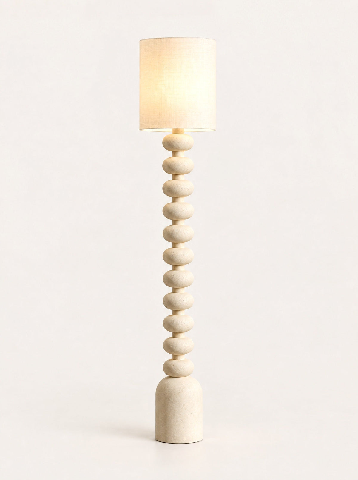 Bead Column Floor Lamp switched on, studio photo on a warm white background