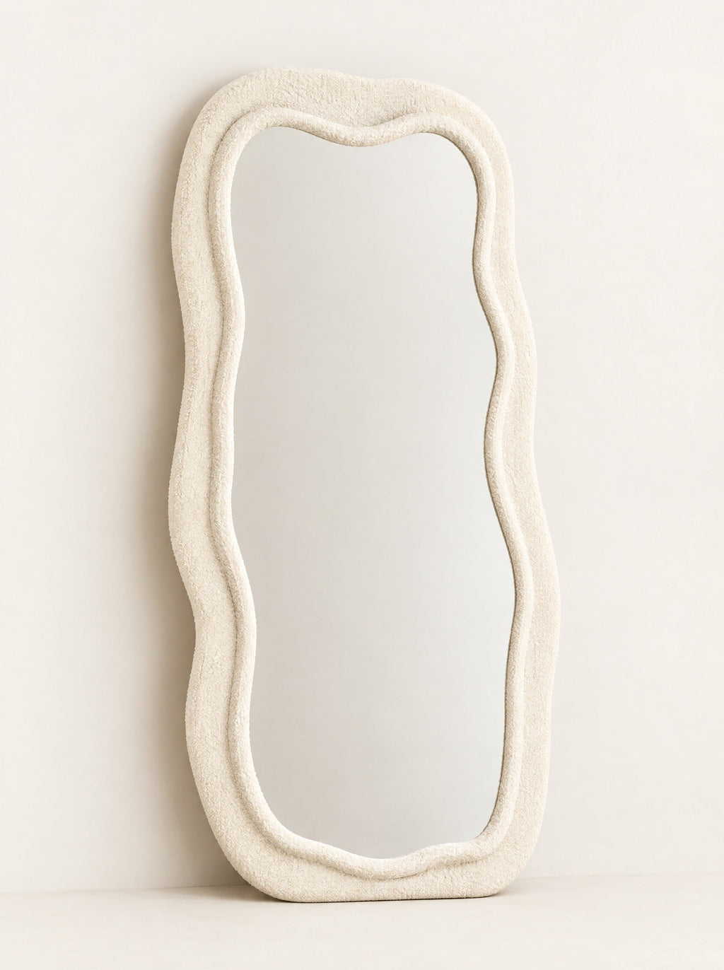 Billow Wavy Floor Mirror, close-up studio photo on a warm white background