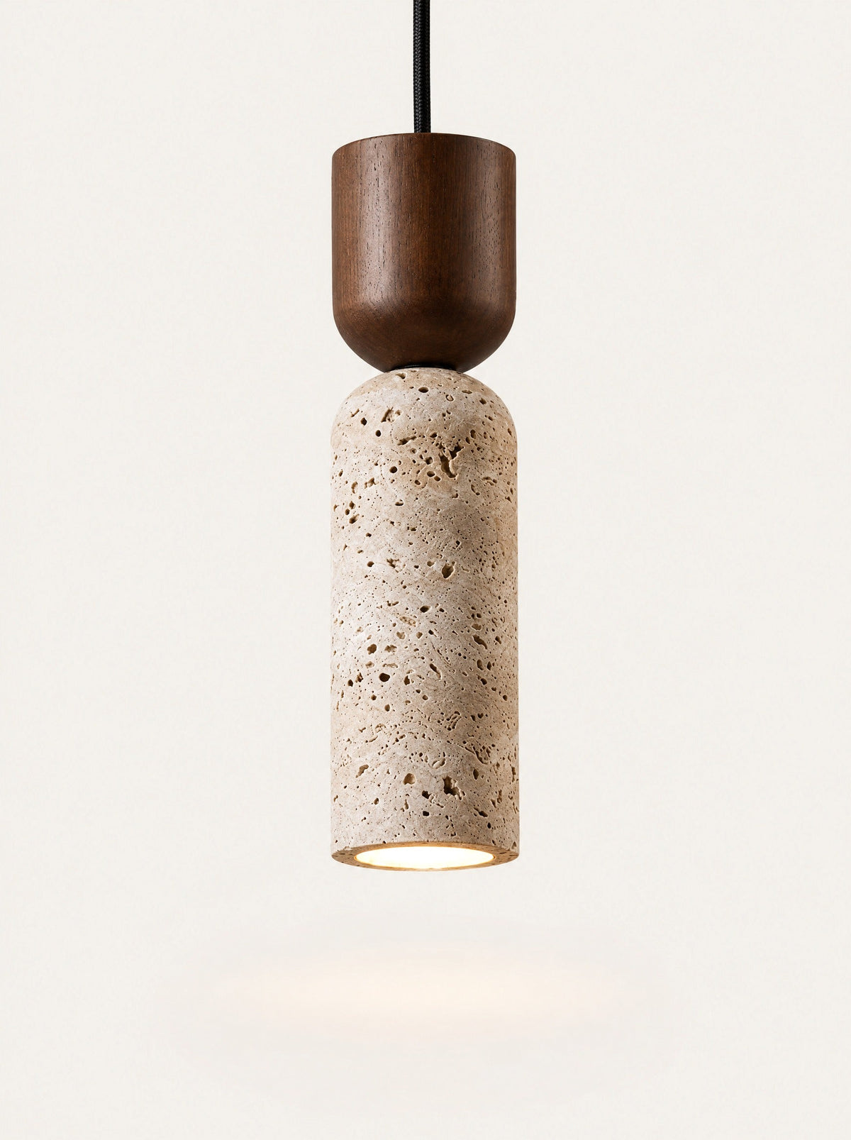 Bollard Travertine & Walnut Pendant switched on, studio photo on a warm white background