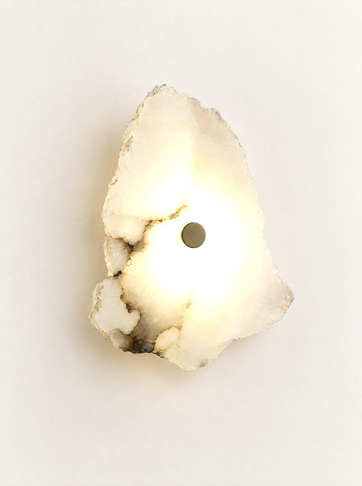 Cascade Marble Wall Light switched on, studio photo on a warm white background