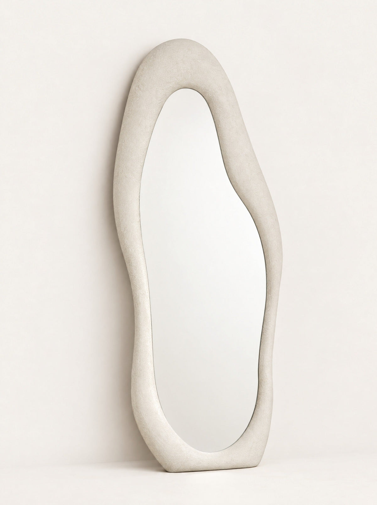 Cloud Organic Floor Mirror, close-up studio photo on a warm white background