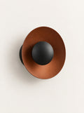 Corona Metal Disc Wall Light, studio photo on a warm white background