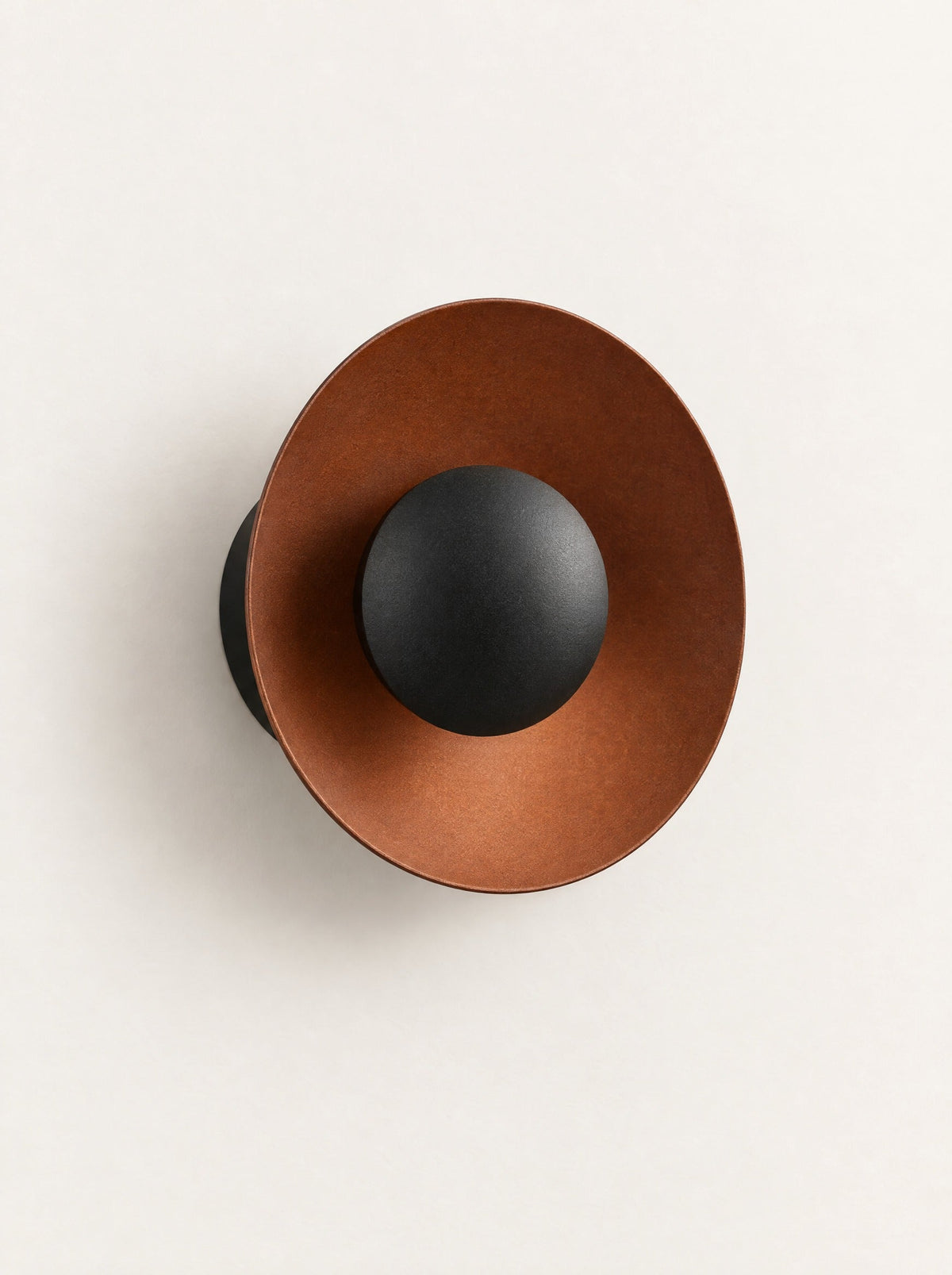 Corona Metal Disc Wall Light, studio photo on a warm white background