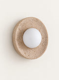 Eclipse Travertine & Opal Sconce, studio photo on a warm white background