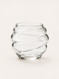 Eddy Ribbed Glass Cup, studio photo on a warm white background