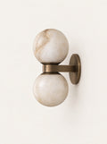 Ember Marble & Copper Sconce, studio photo on a warm white background