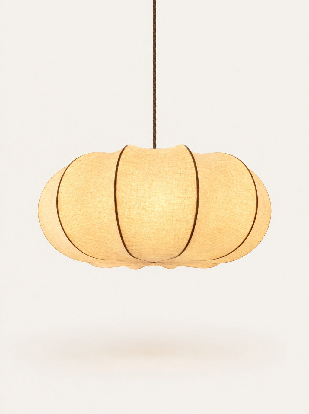 Haze Pleated Pendant switched on, studio photo on a warm white background