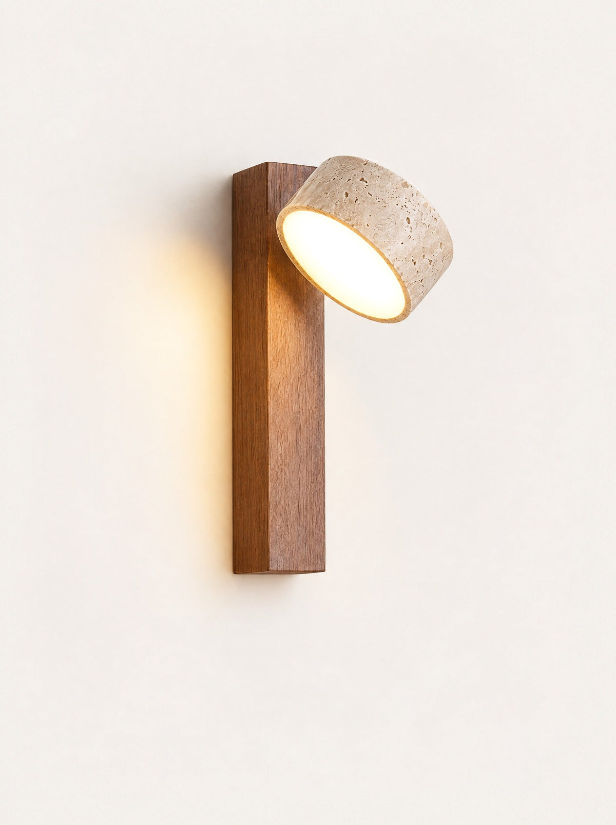 Ledge Marble & Wood Sconce switched on, studio photo on a warm white background