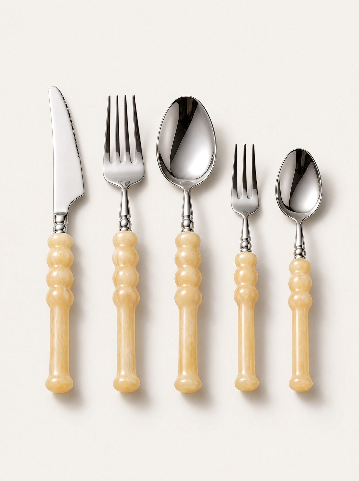 Lucca Resin Cutlery Set, studio photo on a warm white background