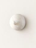 Luna Marble Wall Light, studio photo on a warm white background