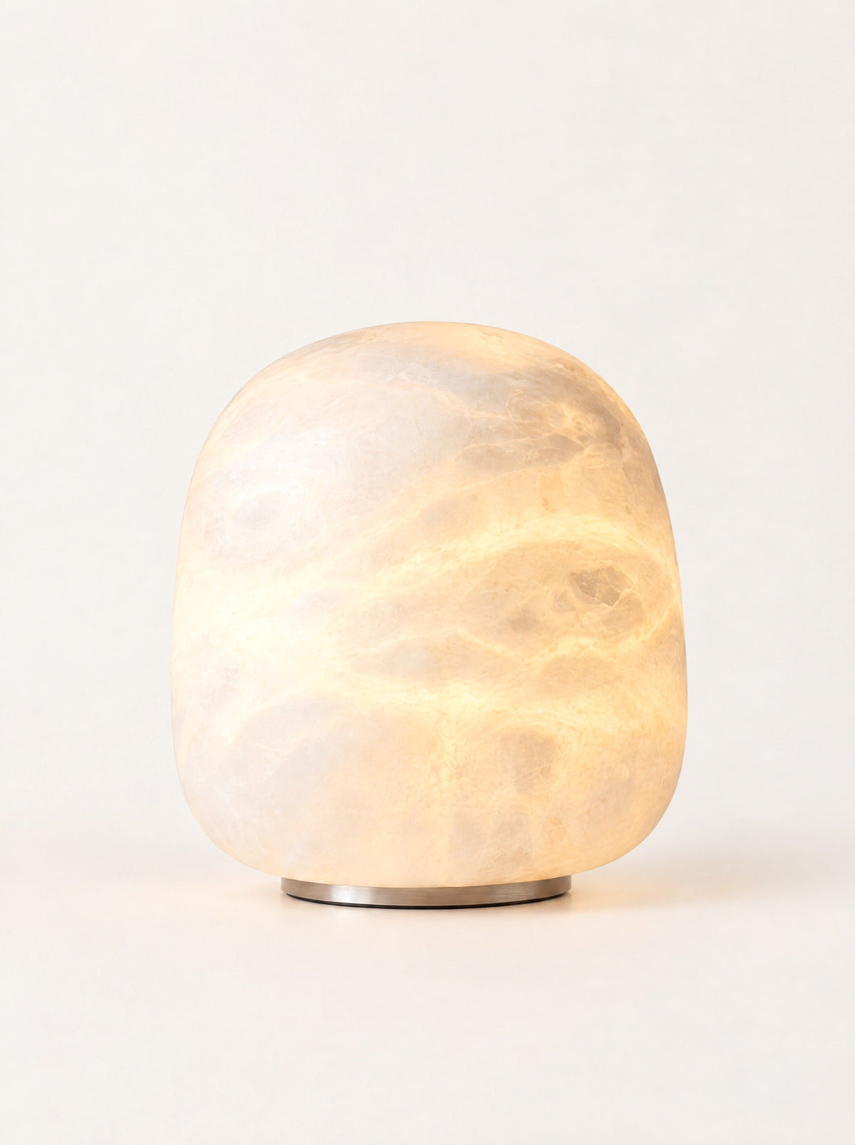 Opal Marble Stone Lamp switched on, studio photo on a warm white background