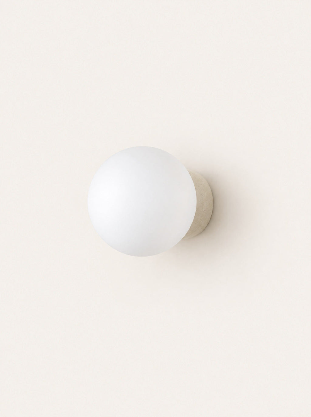 Pebble Glass & Stone Sconce, studio photo on a warm white background