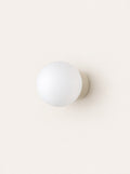 Pebble Glass & Stone Sconce, studio photo on a warm white background