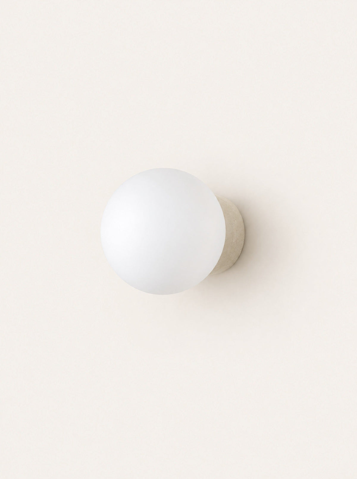 Pebble Glass & Stone Sconce, studio photo on a warm white background