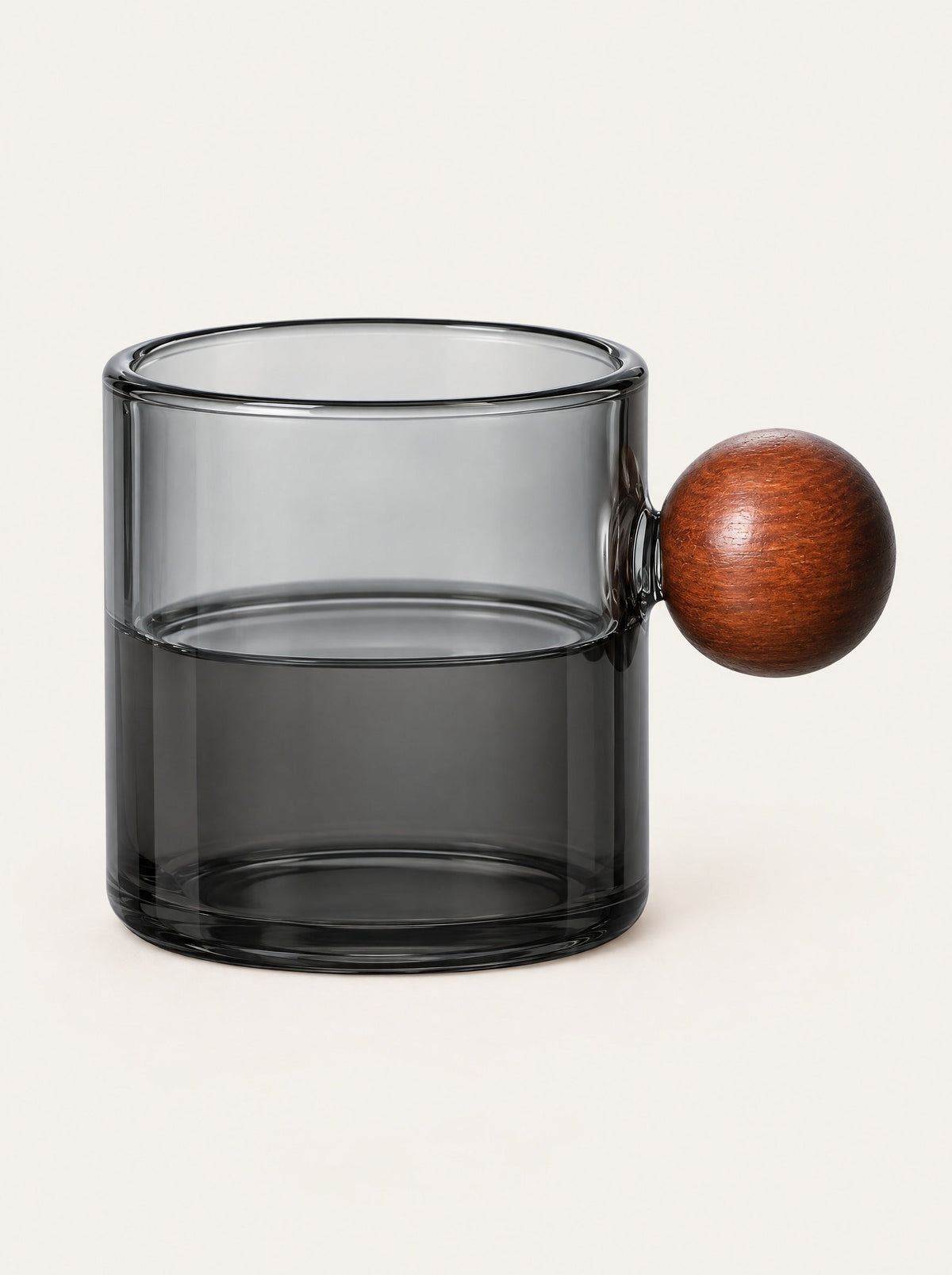 Pinna Tinted Glass Cup, close-up studio photo on a warm white background