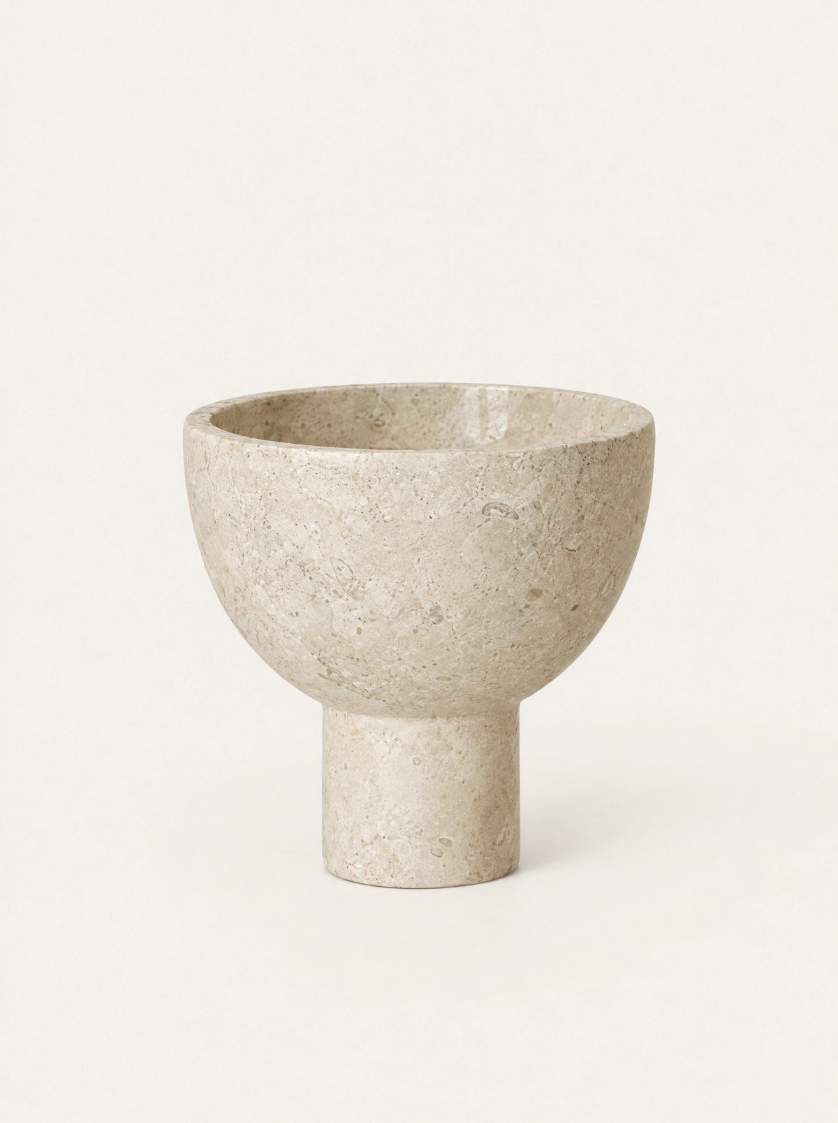 Plinth Stone Pedestal Bowl, studio photo on a warm white background