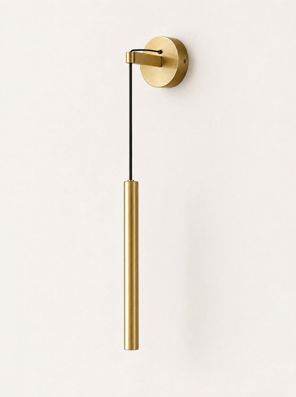Plumb Brass Drop Wall Light, studio photo on a warm white background