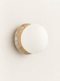 Porthole Stone & Glass Wall Light, studio photo on a warm white background