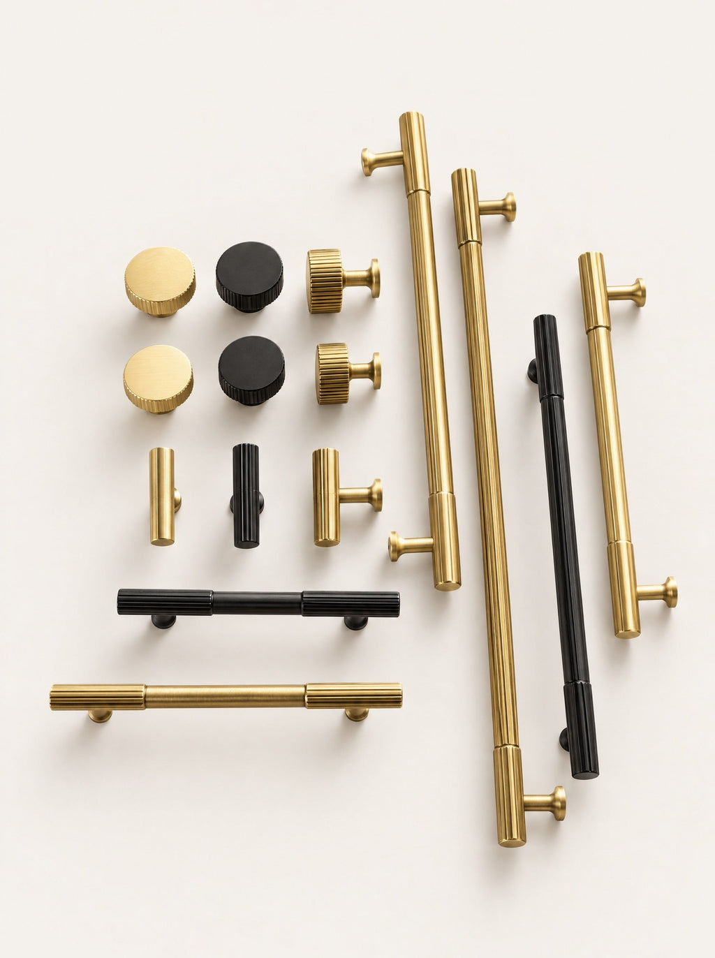 Rib Brass Knob & Pull Collection, close-up studio photo on a warm white background