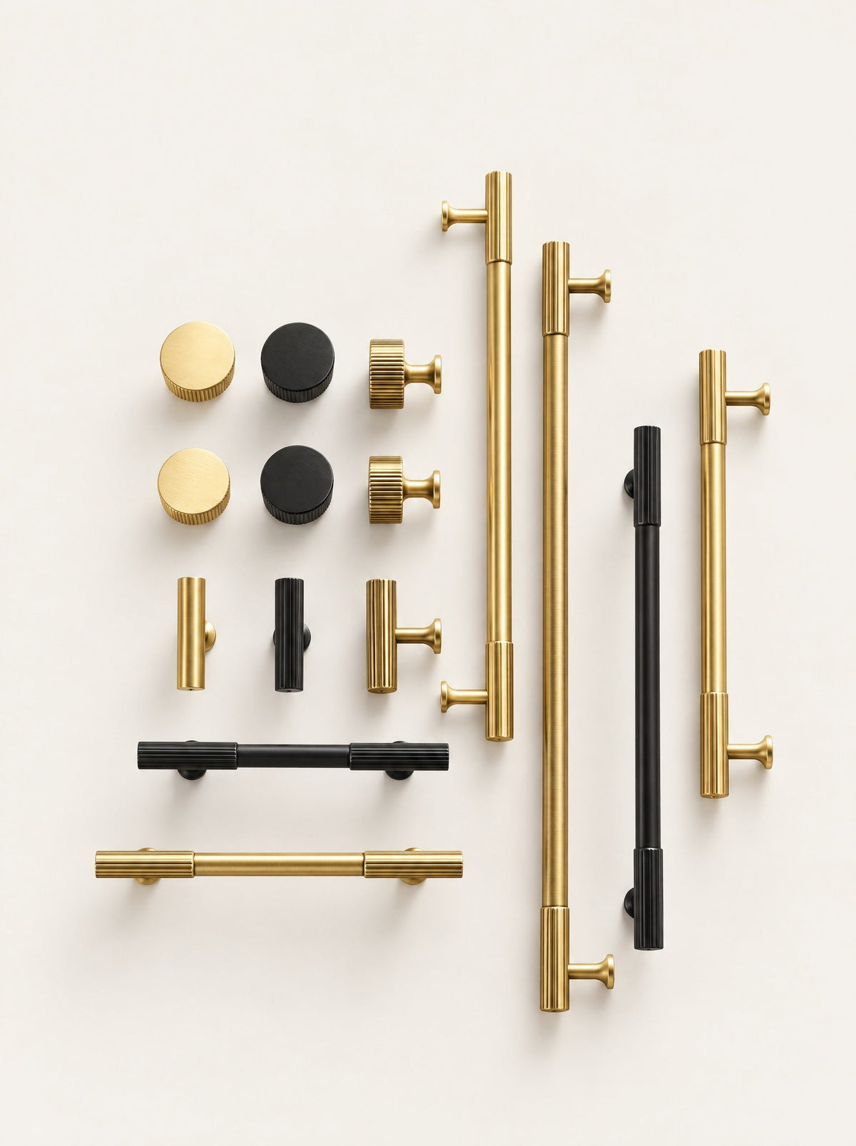 Rib Brass Knob & Pull Collection, studio photo on a warm white background