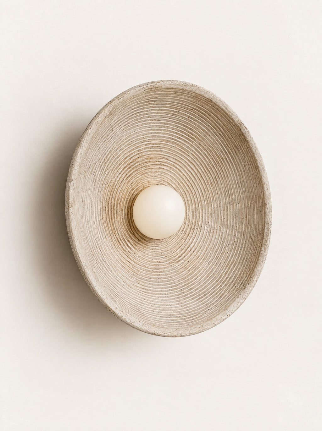 Ripple Disc Wall Light, studio photo on a warm white background