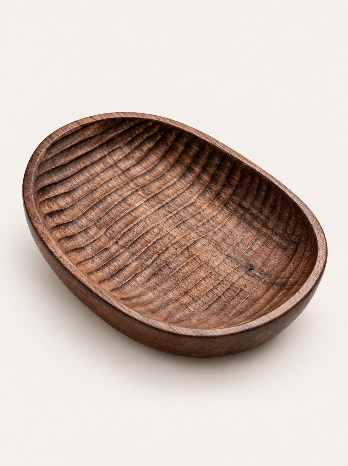 Shell Carved Wood Dish, close-up studio photo on a warm white background