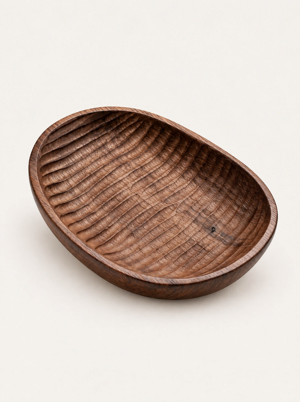 Shell Carved Wood Dish, studio photo on a warm white background
