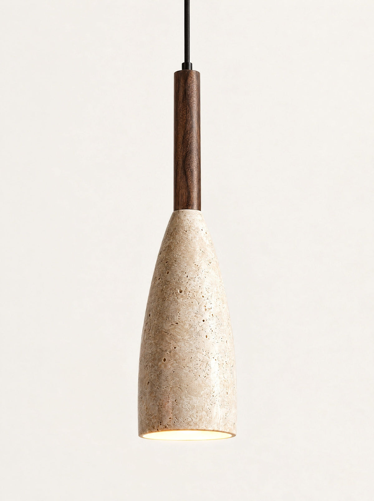 Spindle Travertine Pendant switched on, studio photo on a warm white background