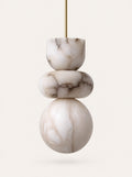 Totem Marble Pendant, studio photo on a warm white background